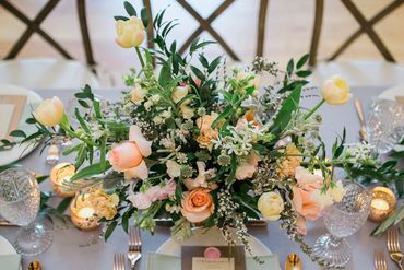 Peach and white spring wedding centerpiece  at Red Maple Vineyard