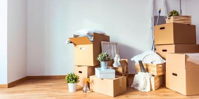 Image of packed boxes and dumpster — for moving-related waste removal