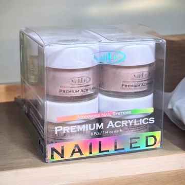 Set of premium acrylic nail powders in clear packaging.