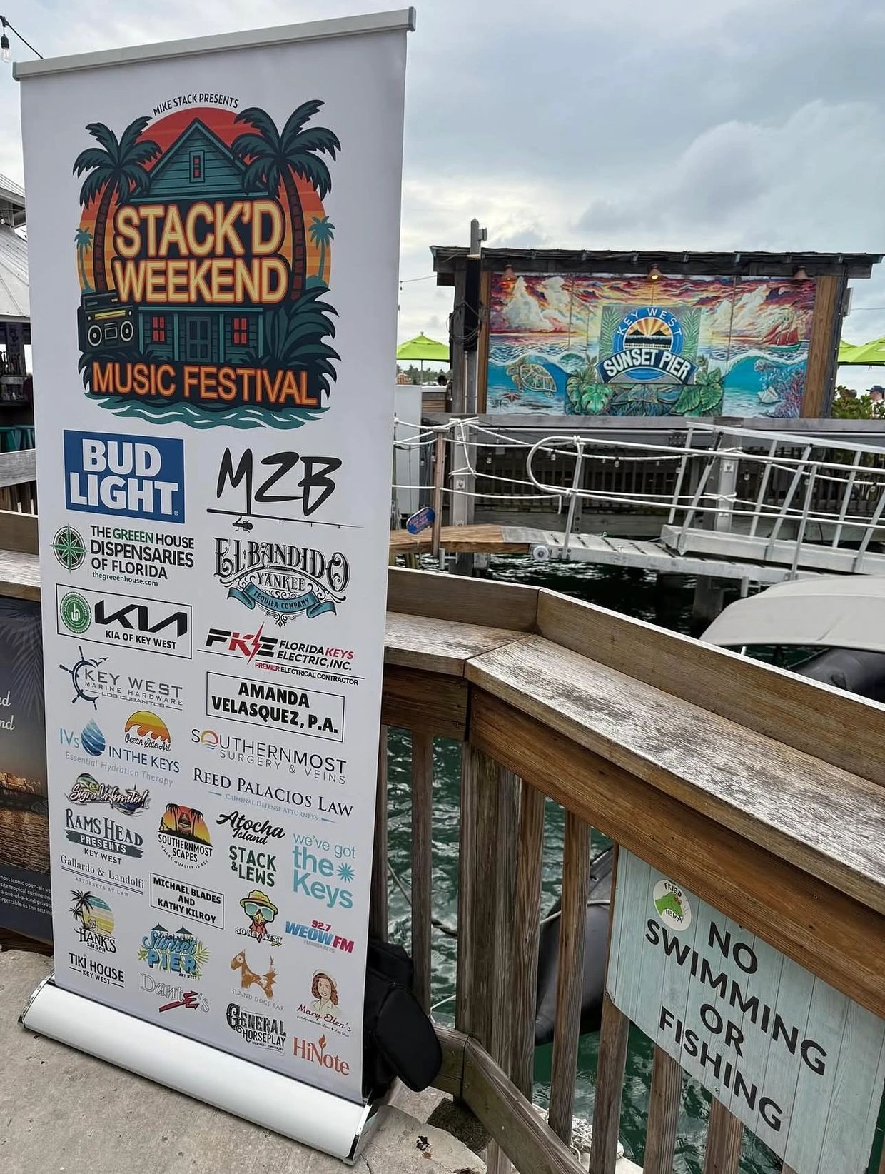 Banner for Stack'd Weekend Music Festival with sponsor logos at Key West Sunset Pier.