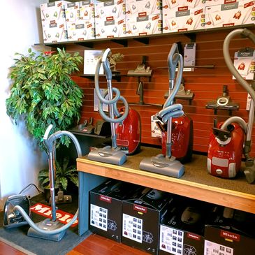Display of new Miele HomeCare vacuums plus demo model (Queen Vacuum - Shrewsbury, NJ) 