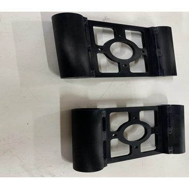 Two identical black metal brackets with cylindrical ends on a white surface.
