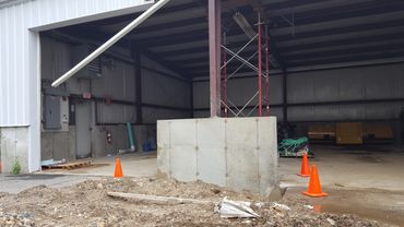 New concrete wall and pier poured and backfilled