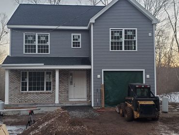 Vinyl siding and brick veneer
