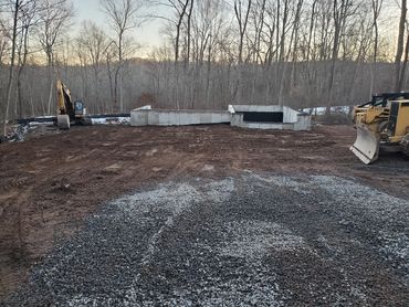 Concrete foundation backfilled
