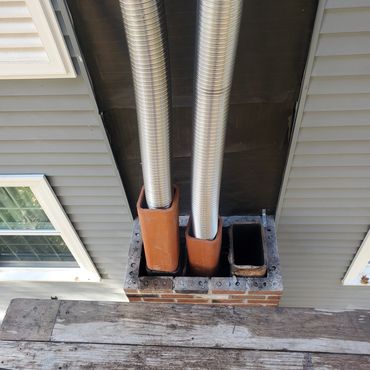 This particular chimney was taken down approx. 10' and rebuilt. Two stainless Steel Liners were inst
