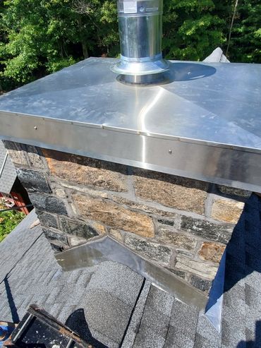 Thompson Blooklawn Blend Thin Stone veneer with through flashing & a custom stainless steel  chase c