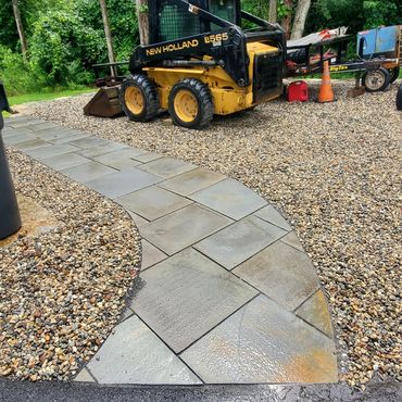Natural old bluestone patio dry laid in stone dust and surrounded by natural 3/4" stone