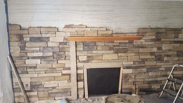 Thin ledge stone interior application
The mantel is set and we continue to build the new stonework t