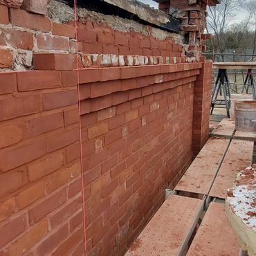 What is Brick Corbeling?
Corbeling is the method of stepping out the brick in a wall to create a pro