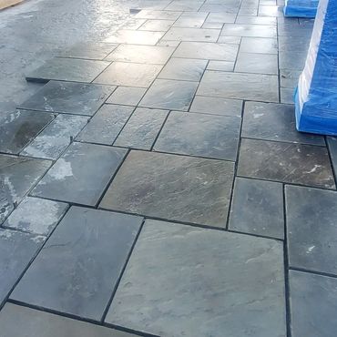 This bluestone was removed, cleaned and relaid in its original pattern. Any broken or bad slabs were