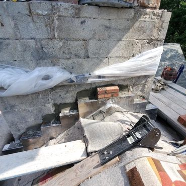 Through flashing installed at the base of the chimney to bring moisture back out once it is soaked u