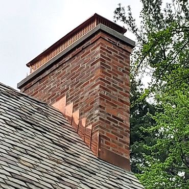 Rebuilt chimney in West Hartford CT with copper through flashing, 3" poured concrete cap and a coppe