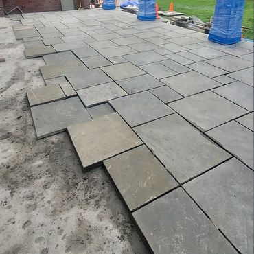 The bluestone pattern is about 75% laid. The next pieces are dry laid to ensure proper bonding/place