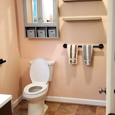 New full bath with vibrant colors on the walls and floor for the new farmhouse addition