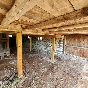 Interior stonework mortar joints and color matches the old existing masonry foundation dating back t