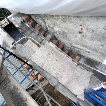 Through flashing installed at the base of the chimney to bring moisture back out once it is soaked u
