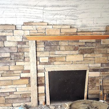 Cultured stone veneer fireplace