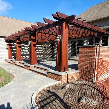 The bluestone patio and privacy wall finished project, absolutely beautiful!