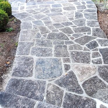 Granite stone walkway leading to pool area