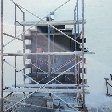 A new opening was needed in this commercial building in Hartford CT .
A steel I-beam is installed t