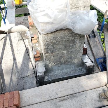 Lead at the base of the chimney at the roof line is weaved into the structure and is considered th