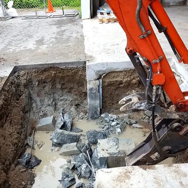 Concrete wall is moved all the way down to the existing footing