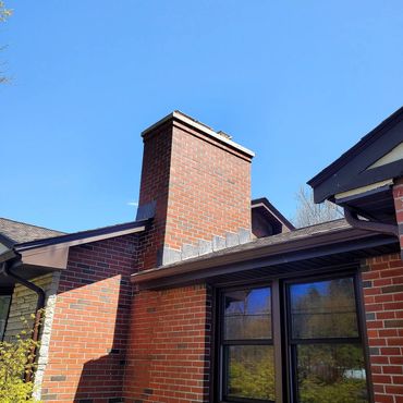 Chimney completed with a 4" reinforced concrete cap. The new bricks used are a perfect match and th