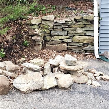 Stone wall in need of repairs