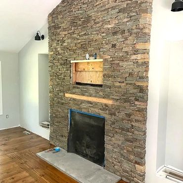 The fireplace is ready for the mantelpiece install and an area left out to receive the big screen TV