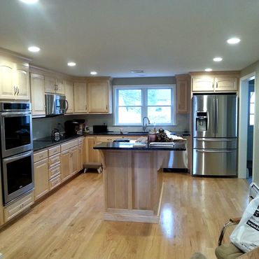 Looking into the new addition and kitchen area. The existing oak flooring was stripped in the living