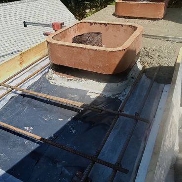 Concrete cap pour in motion, complete with PVC flashing & steel rebar reinforcing