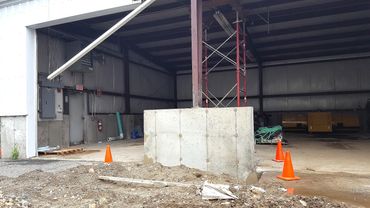 New concrete wall and pier poured and backfilled