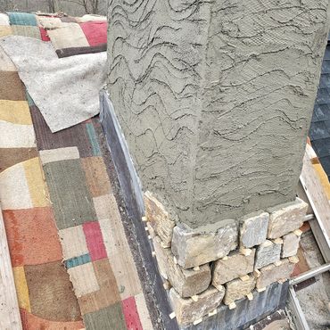 Cultured stone veneer and scratch coat