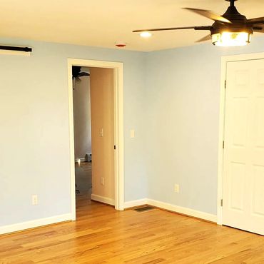 Hardwood floors with white doors, casings and baseboard for this new 900 soft home addition