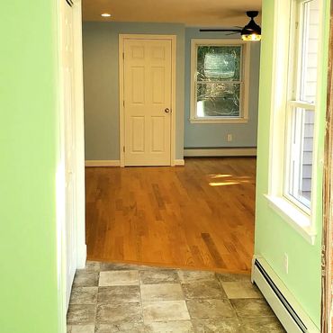 Entrance hallway off the rear deck for the new 900 soft home addition, hardwood flooring and pastel
