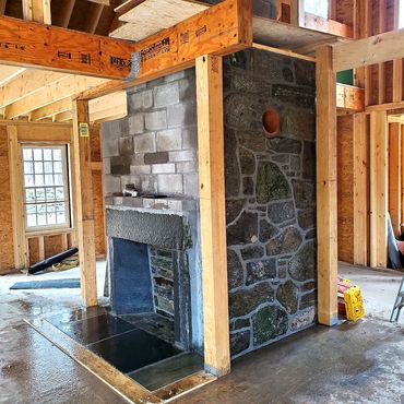 Center chimney & fireplace complete including a wood stove thimble connection off to the side
