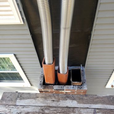 This particular chimney was taken down approx. 10' and rebuilt. Two stainless Steel Liners were inst