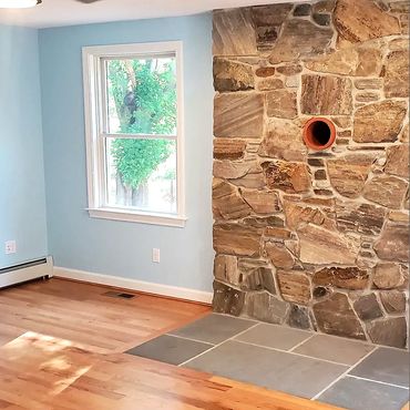 New England fieldstone veneer with a flush bluestone hearth