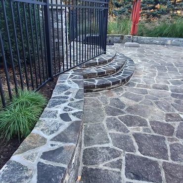 Stone pool patio with vibrant colors