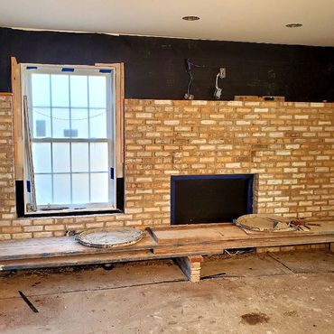 Interior brick veneer with white mortar floor to ceiling