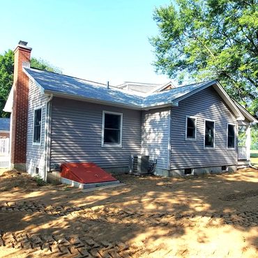 Rear finished elevation showing the bulkhead access to the new farmhouse addition cellar