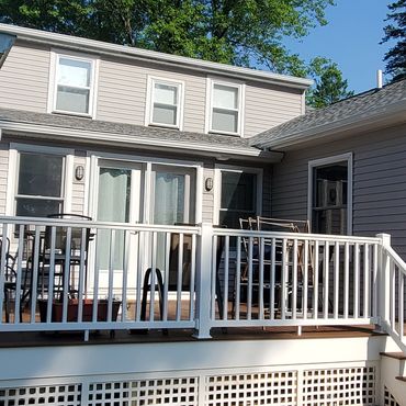 French door leading to new Trex deck with PVC railings