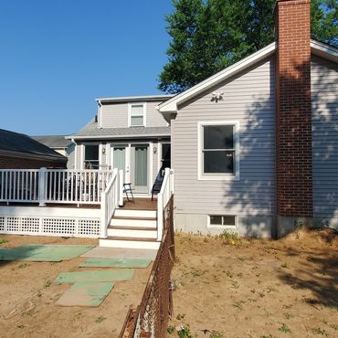 Rear entrance from the back yard to the new 900 square foot farmhouse addition off the new composite