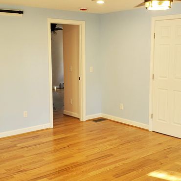 Red Oak hardwood flooring with colonial baseboard and trim