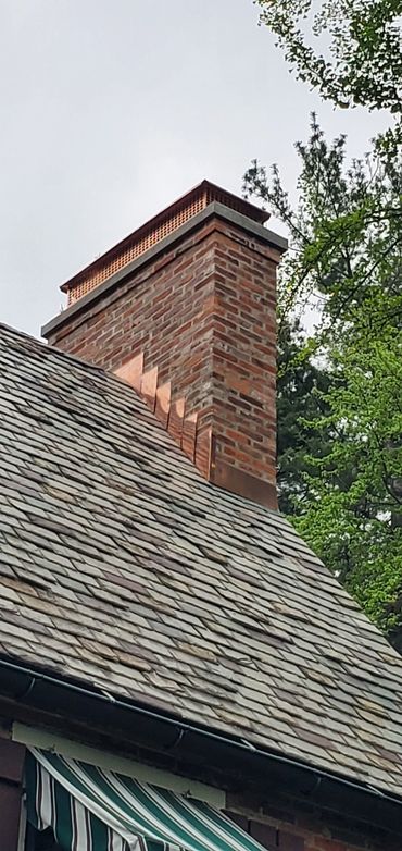 Rebuilt chimney in West Hartford CT with copper through flashing, 3" poured concrete cap and a coppe