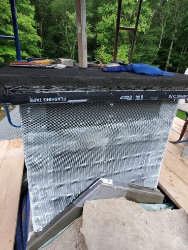 Installed through flashing, moisture barrier and wire lath for stone veneer prep