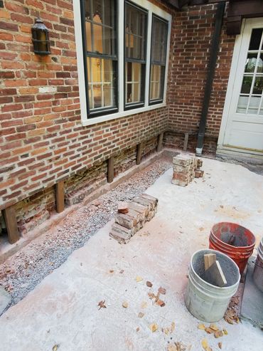 Existing bricks are cleaned for re-use