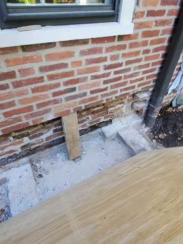 Lowest 6 brick courses are removed