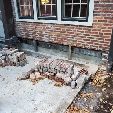Exterior brick leaf shored in place